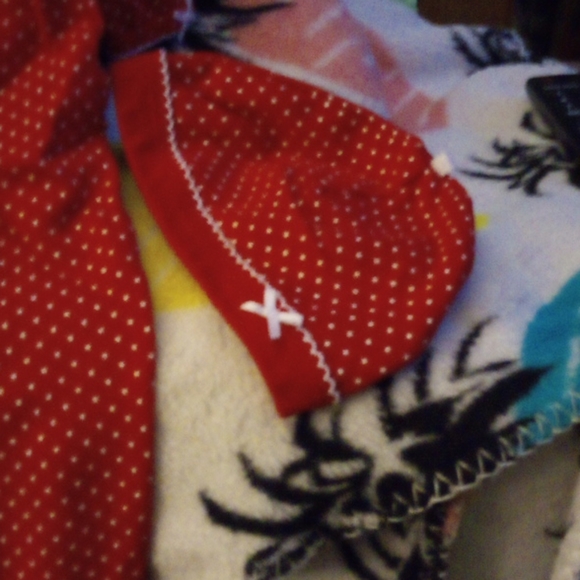 A baby a sleeper it has red with white spots littl - Picture 3 of 4